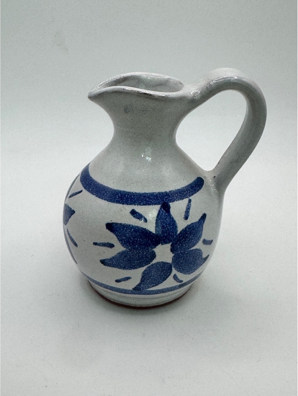 Vintage Handcrafted Terracotta Pitcher with Blue Floral Design